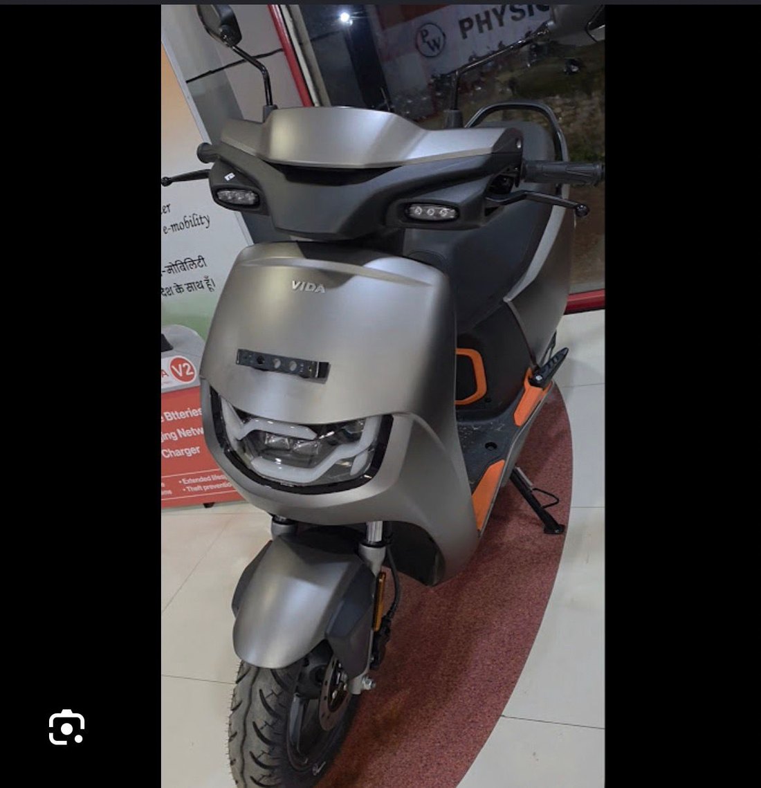 2026 electric scooter front view at an Indian dealership